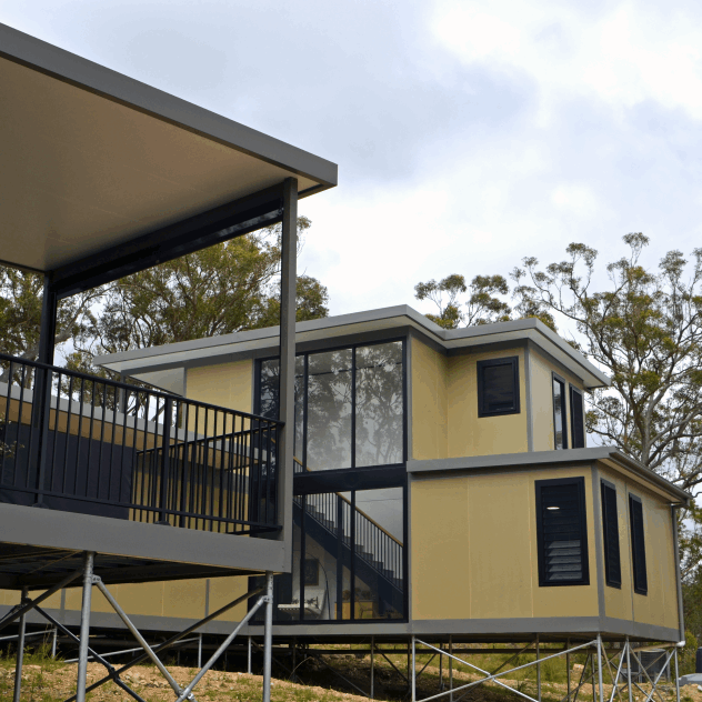 Shows a double storey panelised modular house. This method minimised wasted time, labour and materials