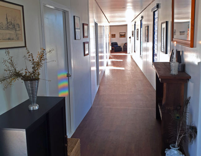 MAAP House_wide bright hallway with timber floors