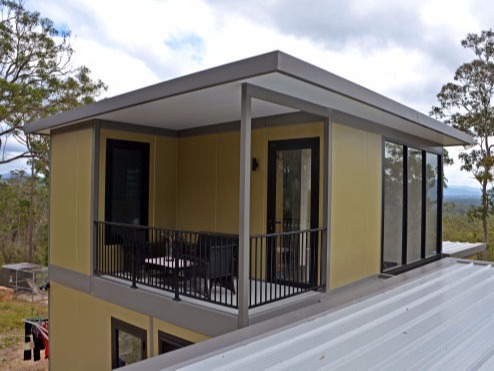 Shows women’s refuge units built by MAAP House. They are used to accommodate those experiencing hardship