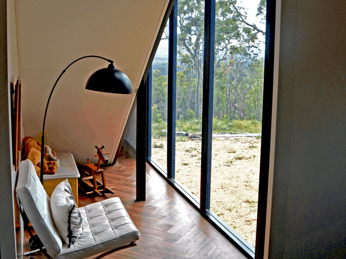 A beautiflu nook under the stairs looks out on the Aussie bush from our Cellito MAAP House