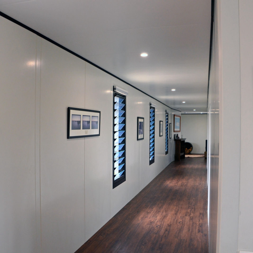 A long straight corridor wall show the on-site precision gained when using the MAAP hybrid modualr system